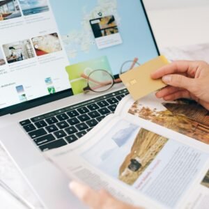 Person holding credit card and searching on the internet