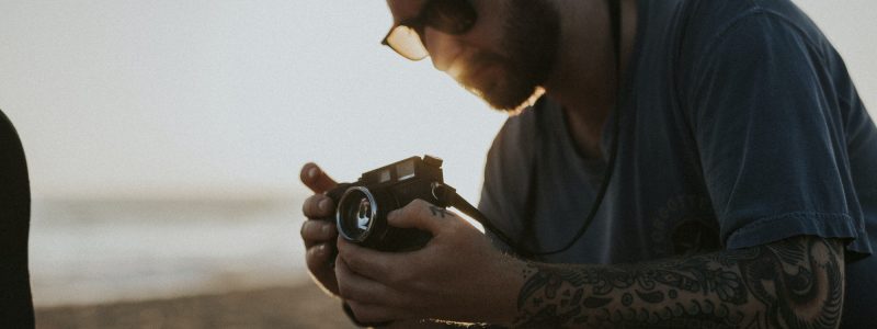 Male travel photographer in California